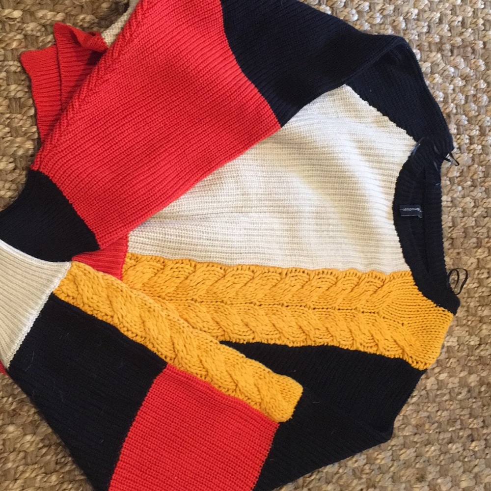 NWOT black/orange/cream/yellow knit size small